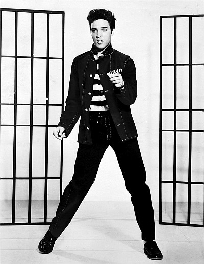 Black-and-white photo of Elvis dancing