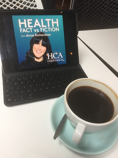 Health Fact vs Fiction cover shown on a device, next to a cup of coffee